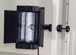 Mobile video lighting unit attached to a vertical metal bar.